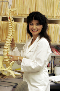 Dr. Shaw with a model of a spinal cord